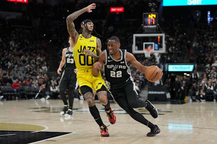 Branham shoves his way to the basket against Jordan Clarkson.